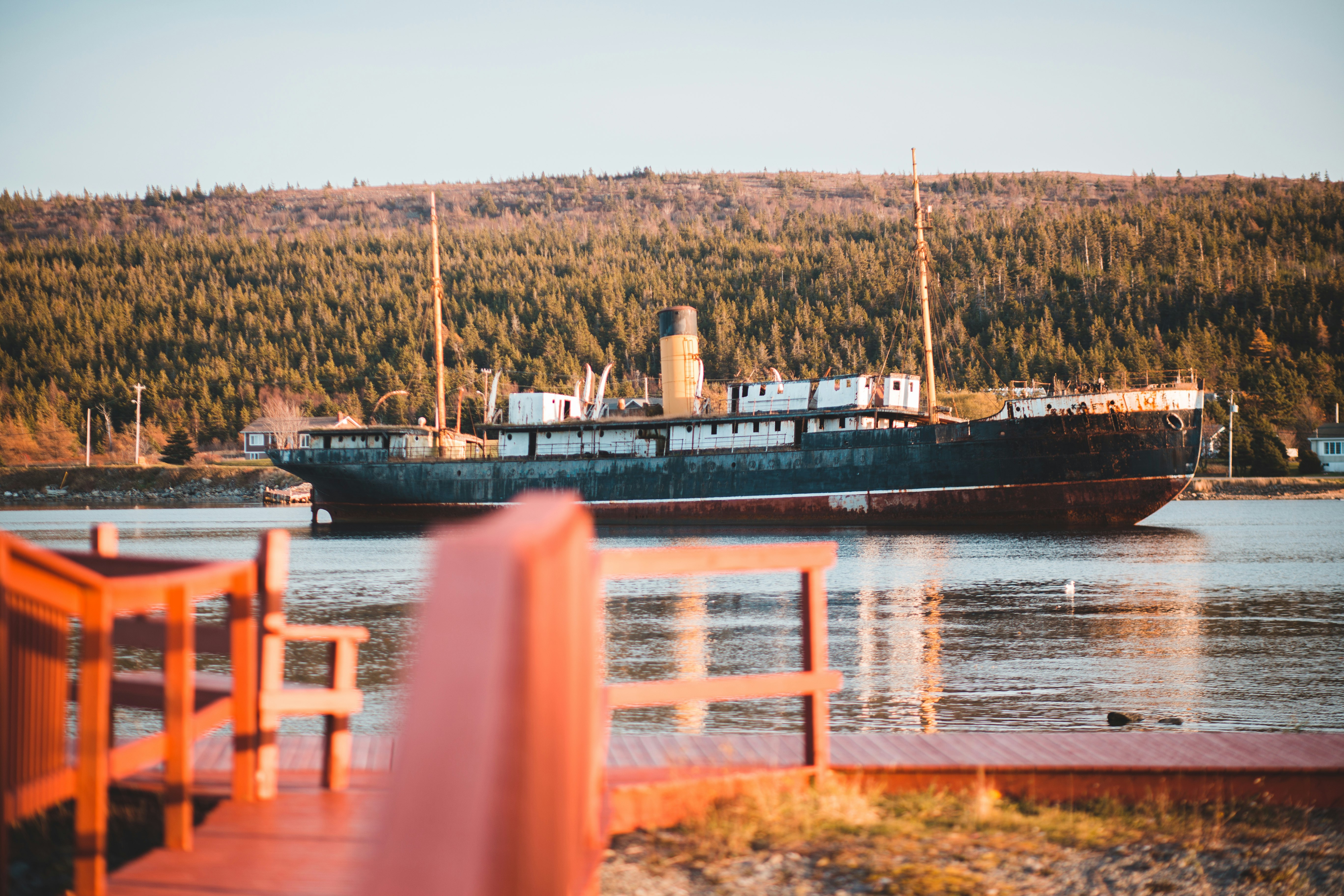 photo of gray and red cargo ship